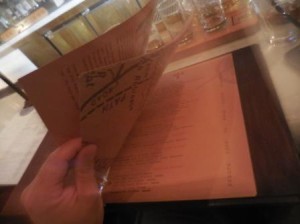 Flipping through the new whiskey menu at Todd English P.U.B.