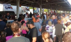 Attendees lined-up for beers, while breweries featured their brews alongside each other