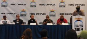 Alex Segura speaking, while other panelists look on